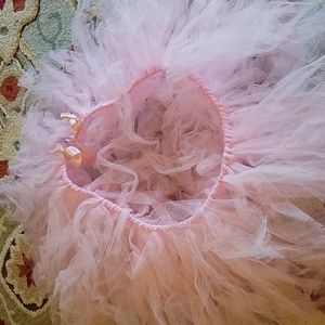 Light pink highchair tutu used for birthday parties or celebrations.